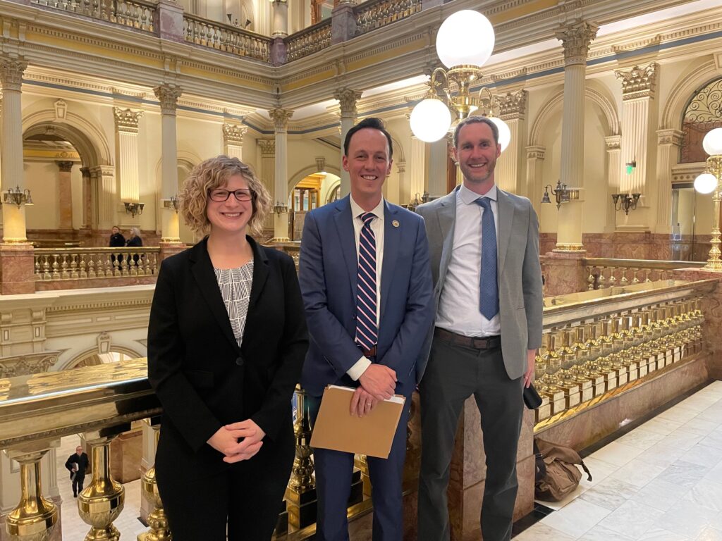 a photo of Kim, Senator Dylan Roberts, and Dan DeLaughter from South Platte Renew, who also testified (left to right)