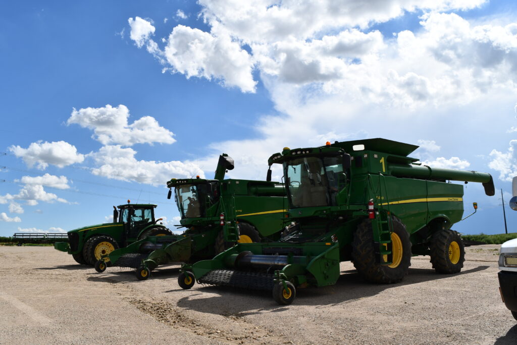 A photo of Farm harvesters parked