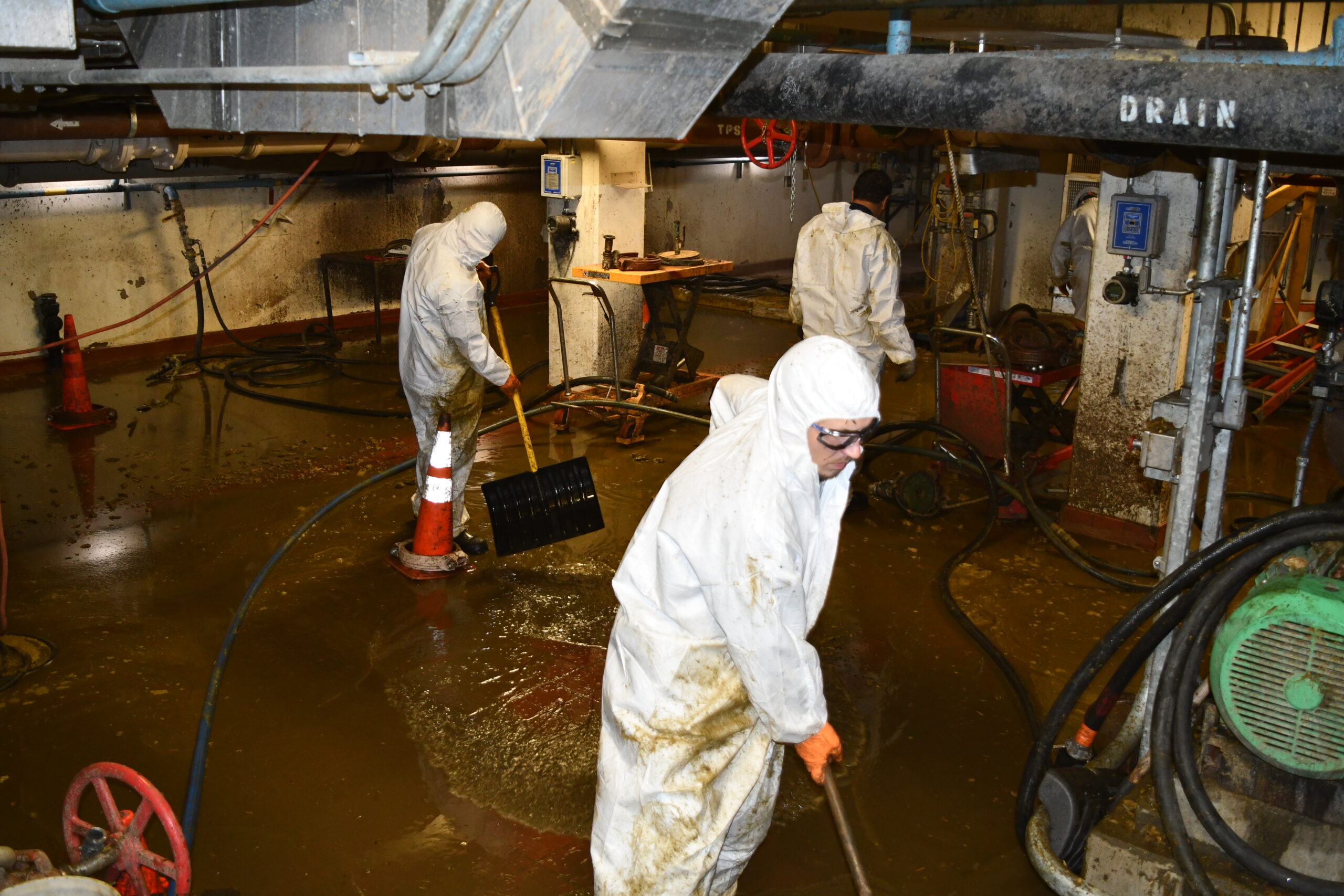a group of workers cleaning up after a job