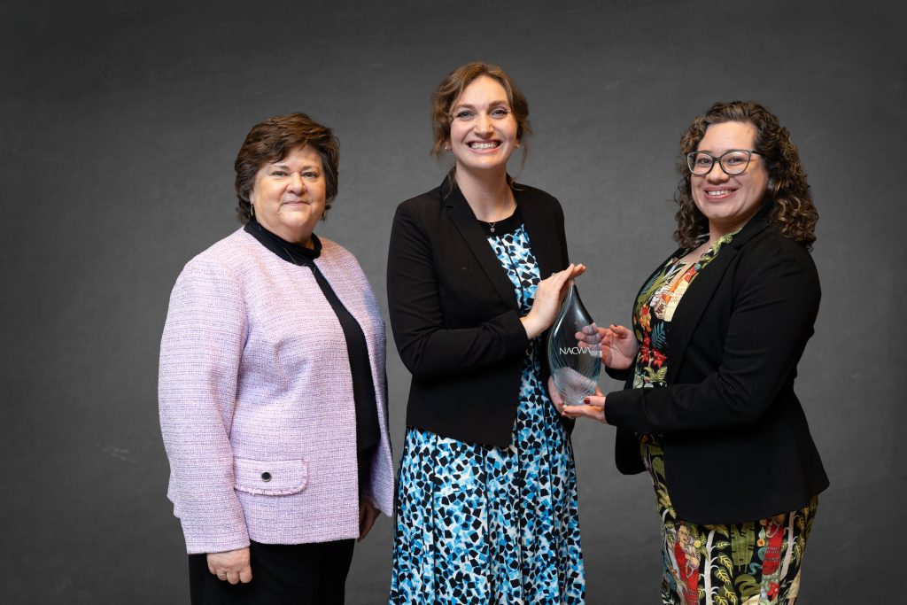 Public Information Officers Amy Lovatt and Maritza Franco posing with an award.